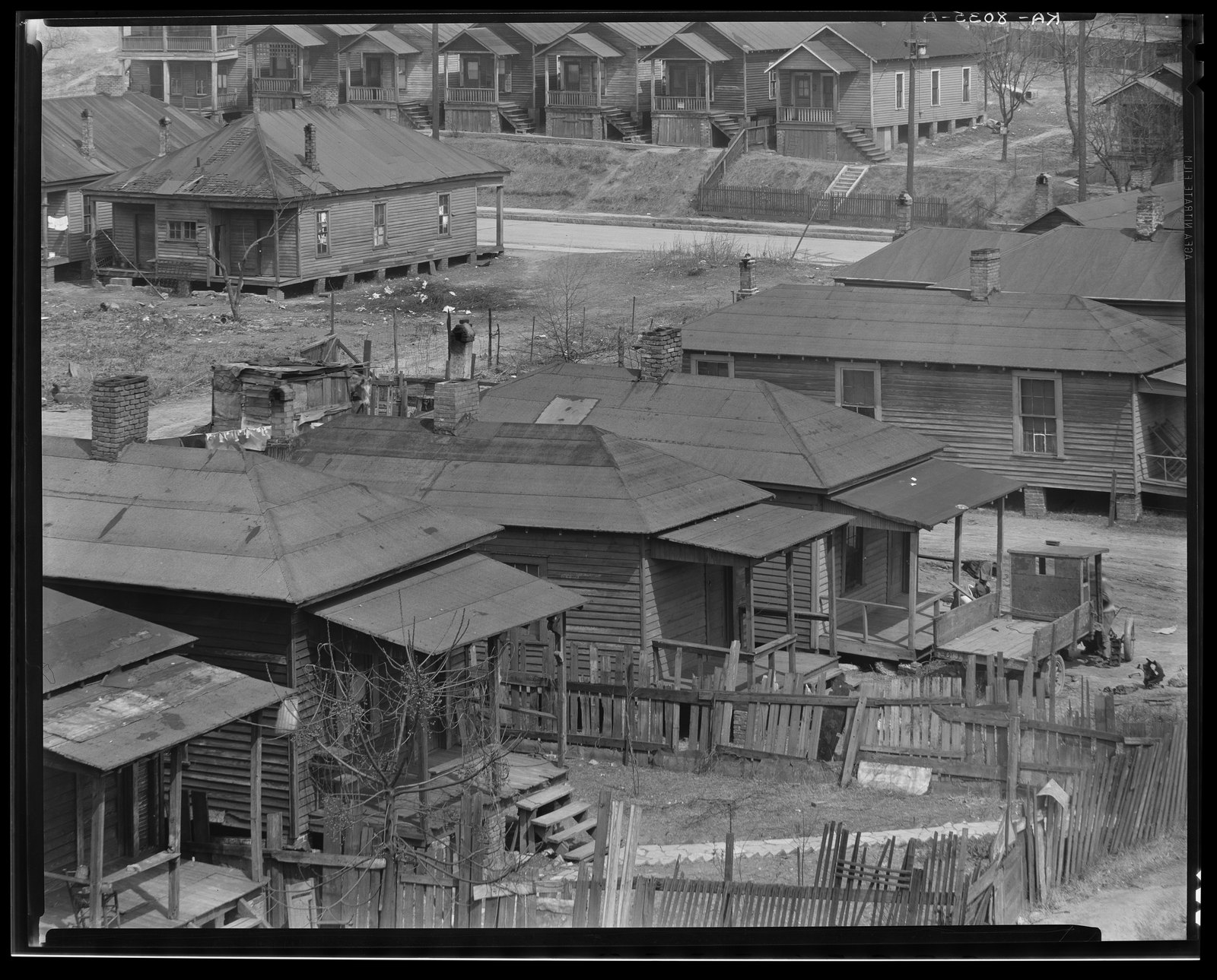 Piedmont Avenue, a paved street with numbers painted on the curb. Walker Evans, Atlanta, Georgia (1936)